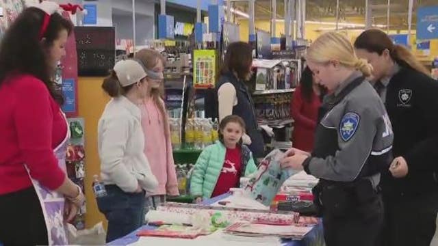 Tacoma Police spread holiday cheer with the annual 'Shop With A Cop'