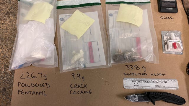 SPD: Man arrested for carrying guns, drugs in two different cars