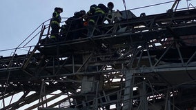 Crews rescue person who became pinned on elevated conveyor belt near Salmon Bay