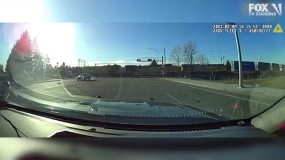 WATCH: Robbery suspect narrowly misses oncoming train trying to evade Auburn police