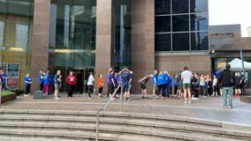 Hundreds climb the stairs of Seattle's Columbia Center for cancer research