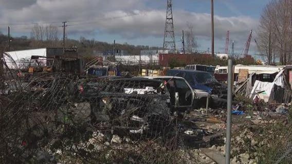 Inslee visits Seattle encampment during cleanup, urges legislators to fund affordable housing
