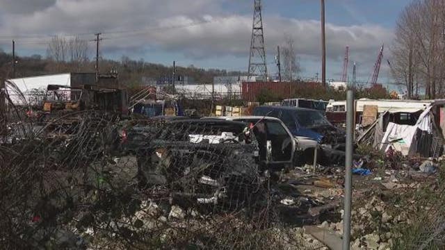 Inslee visits Seattle encampment during cleanup, urges legislators to fund affordable housing