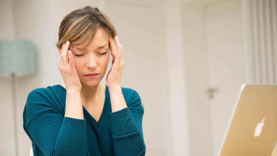 WOMAN WITH HEADACHE