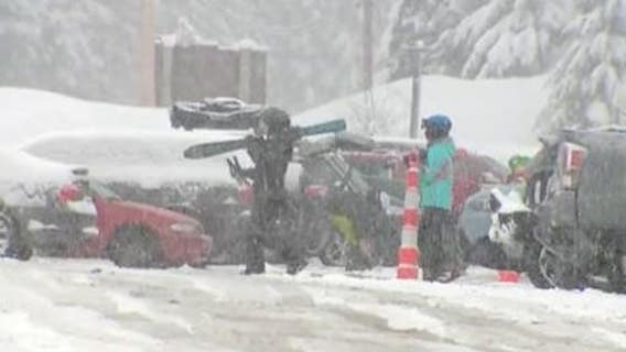 More snow falls over Snoqualmie Pass