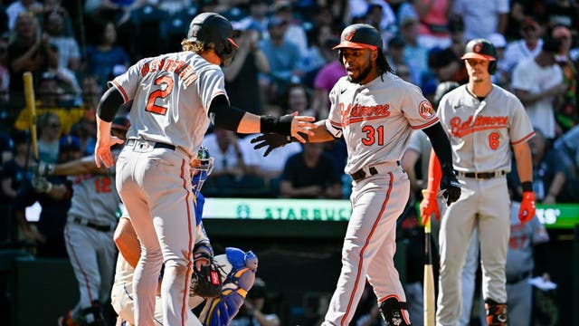 Cedric Mullins robs homer in 9th, hits 2-run shot in 10th; AL-best Orioles beat Mariners 5-3