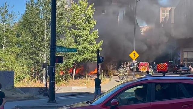 Man arrested for reckless burning after Seattle encampment fire by I-5 Mercer ramp