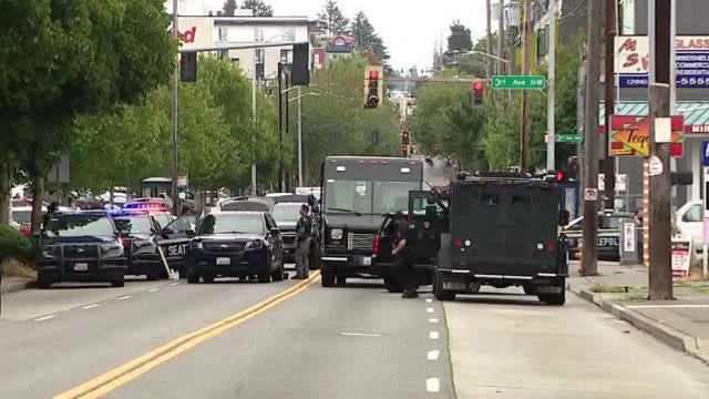 SPD: Man arrested after holding woman hostage with gun