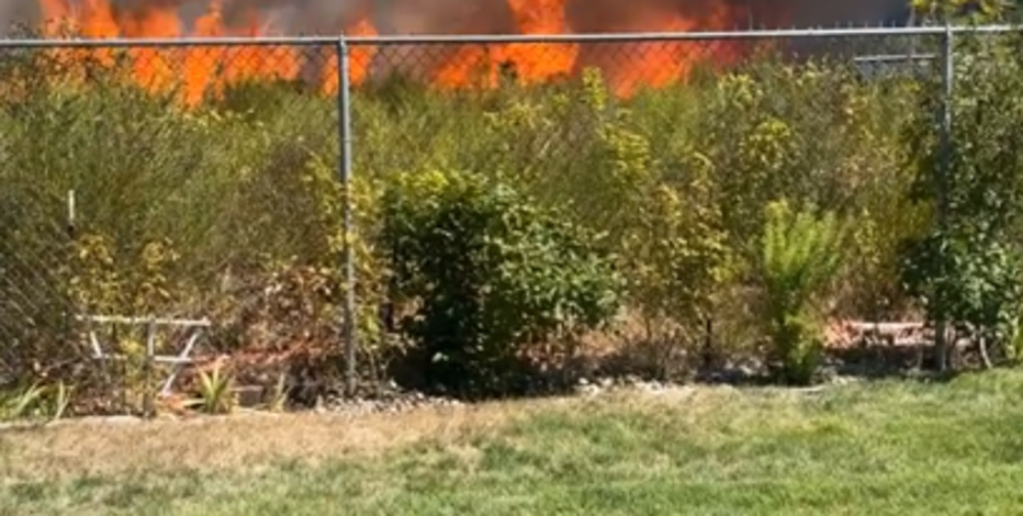 Video shows wall of flames heading towards Lakewood neighborhood as residents fled, fought to save homes