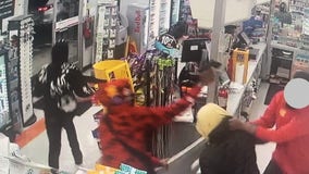 VIDEO: 7 masked suspects rob gas station in North Seattle, clerk fights back