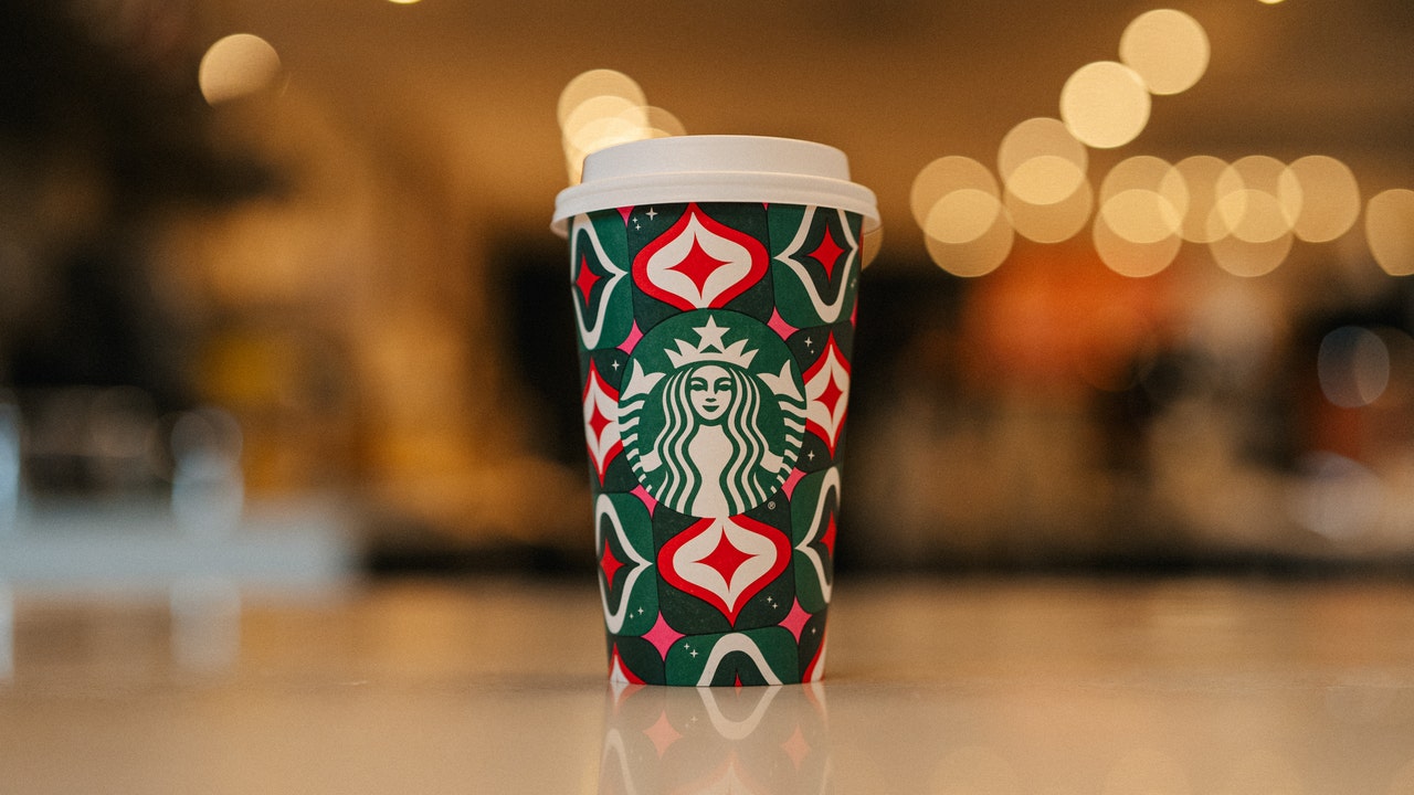 After last year's drama, Starbucks unveils holiday cups designed by 13  women