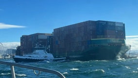 Barge full of containers breaks loose, strikes pier along Seattle waterfront