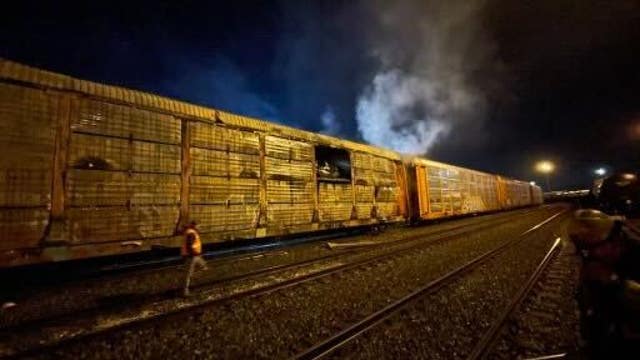 Train car full of vehicles catches on fire in Tacoma
