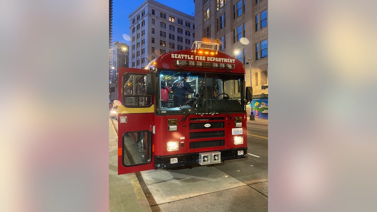 Seattle Firefighters use big red bus to save people from the cold