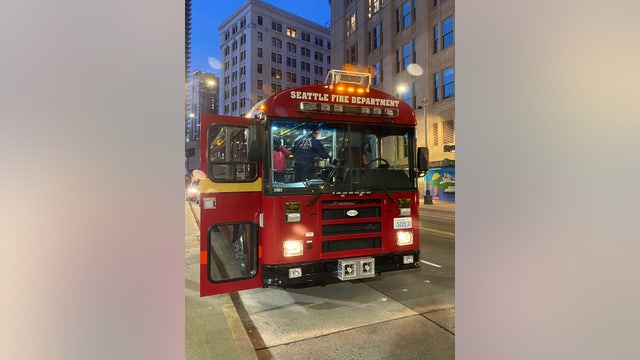 Seattle Firefighters use big red bus to save people from the cold