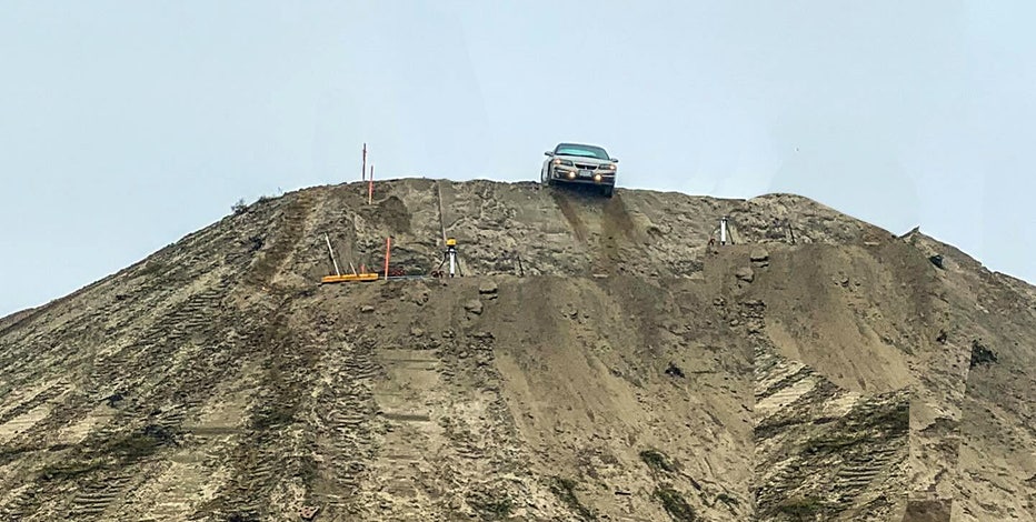 Disoriented driver misses construction sign, ends up in precarious spot