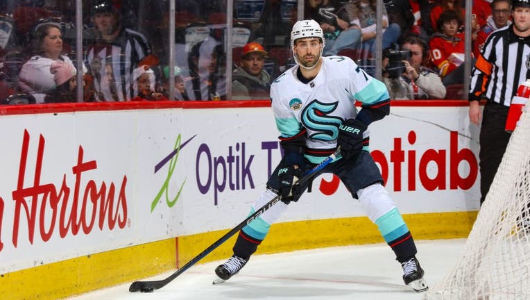 Seattle Kraken's Jordan Eberle handles puck against Calgary Flames