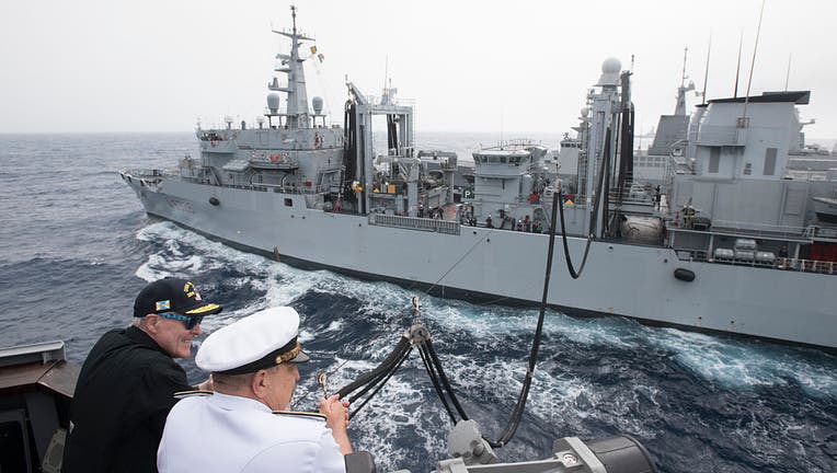 FILE - Secretary of the Navy (SECNAV) Ray Mabus, left, observes an underway replenishment with Adm. Giuseppe De Giorgi, chief of the Italian navy, while aboard the guided-missile destroyer USS Mason (DDG 87) on June 16, 2016. (Photo by Armando Gonzales/US Navy/Getty Images)