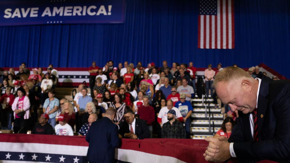 matthew maddock praying at a rally