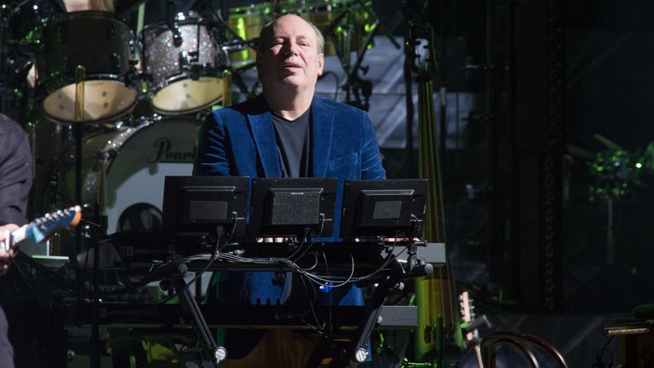 photo of hans zimmer playing keyboard during a live performance in Paris, France