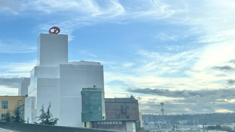 old rainier building wrapped in white plastic