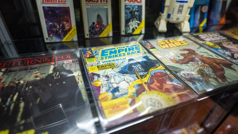 star wars comic books and toys on display at exhibit