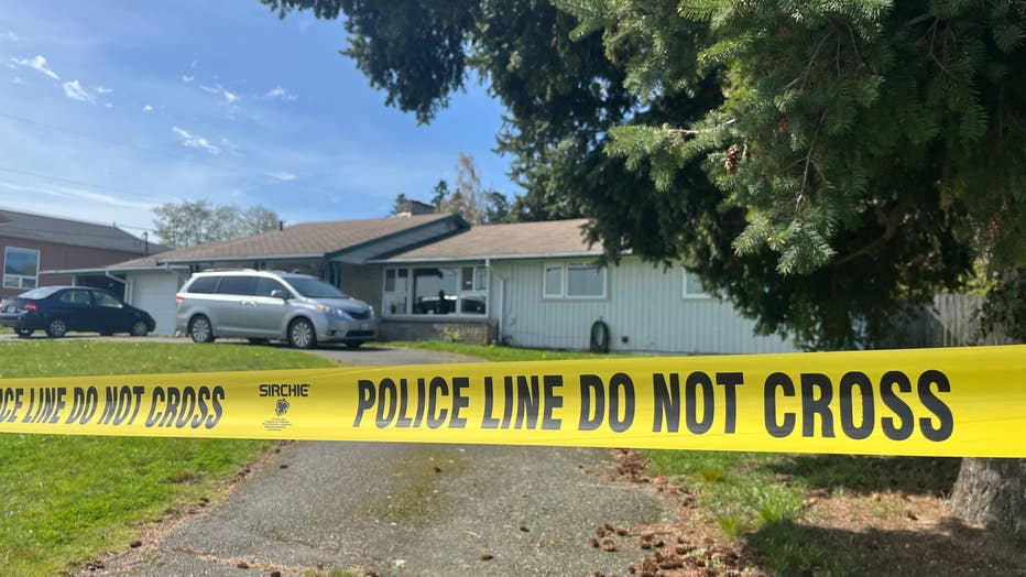 police crime tape in front of home