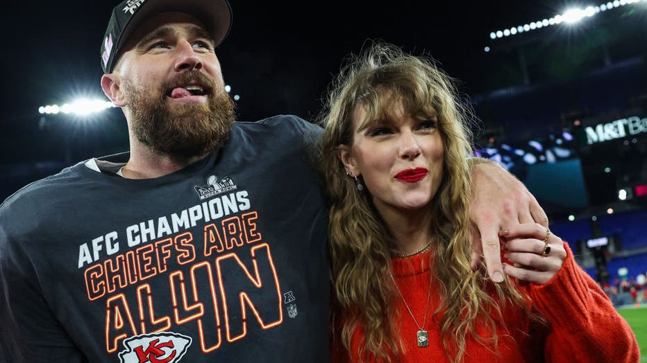 travis kelce with his arm around taylor swift after winning the super bowl