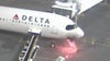 Video shows moment Delta plane catches fire at Sea-Tac, passengers evacuate using slides