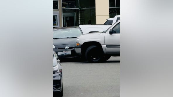 VIDEO: Shocked Fred Meyer shoppers watch as SUV driver rams Prius out of the way to escape Seattle Police