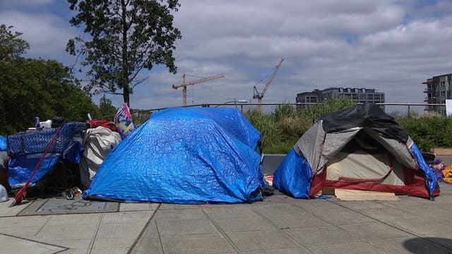 Unhoused encampment along busy Seattle thoroughfare faces imminent sweep