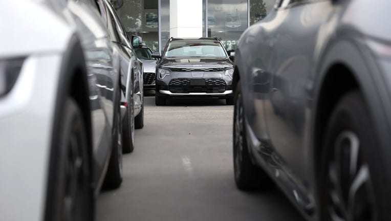 FILE - New Kia cars are displayed on the sales lot at San Leandro Kia on May 30, 2023, in San Leandro, California. (Photo by Justin Sullivan/Getty Images)