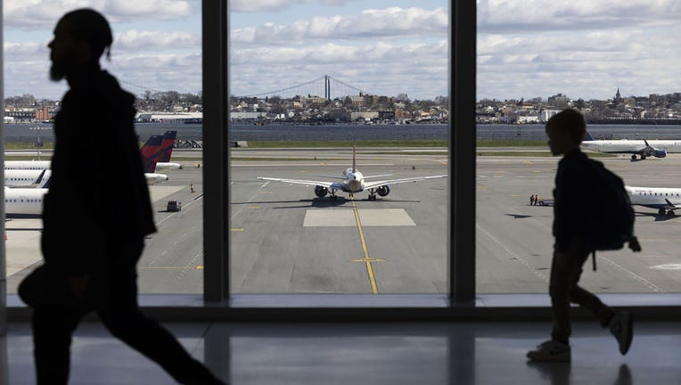 FILE - Delta planes at Terminal C of LaGuardia Airport (LGA) in the Queens borough of New York, US, on Sunday, April 7, 2024. Photographer: Angus Mordant/Bloomberg via Getty Images