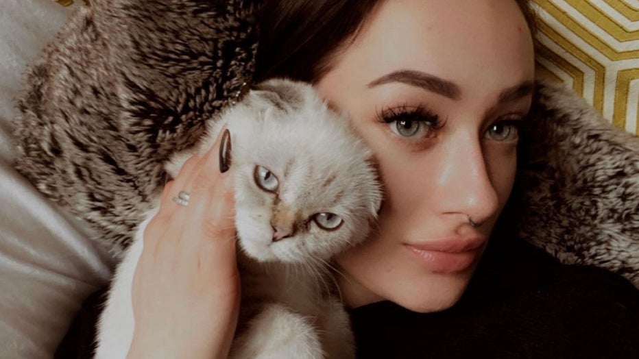liliya guyvoronsky in an image with a cat