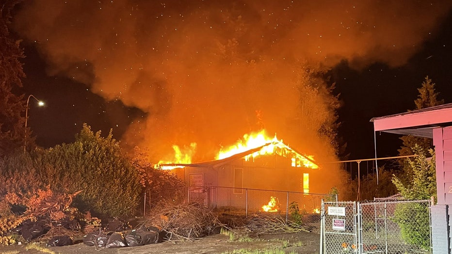 photo of flames and smoke billowing out of an abandoned fire that happened in Kent early Friday morning