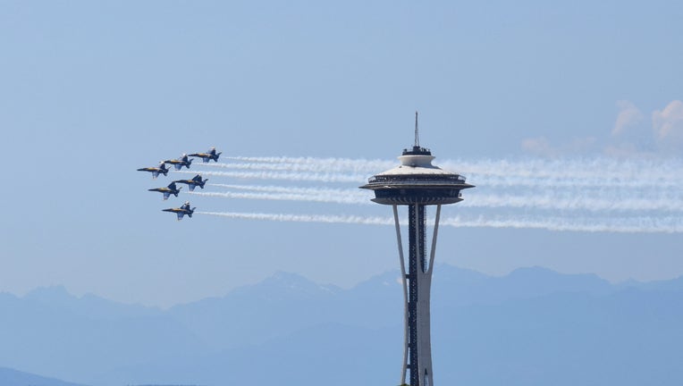 us navy blue angels with space needle in the background