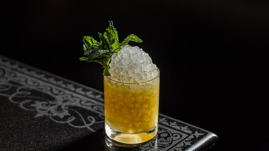 cornicello cocktail with mint leaf