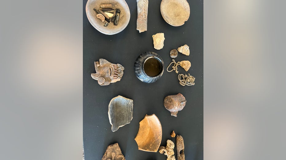 ancient mexican artifacts on a table