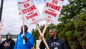 Security guard flashed gun at Boeing workers on strike, authorities say