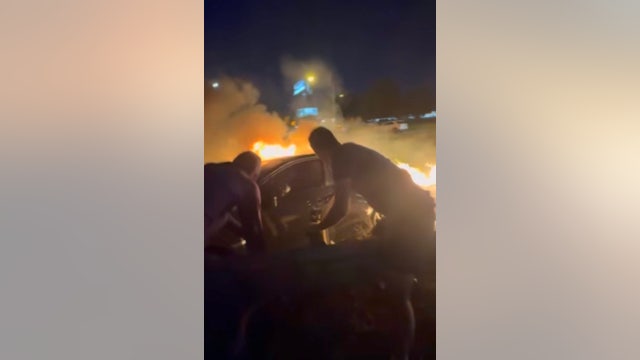 Dramatic video in Fife shows rescuers saving man trapped in burning Subaru