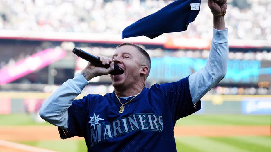 macklemore singing at mariners game on field