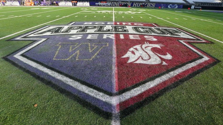 apple cup logo on football field