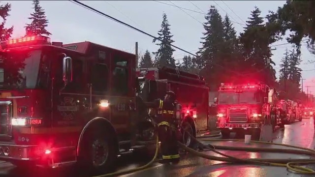 ‘Smoke really started pouring in': Fire rips through North Seattle house
