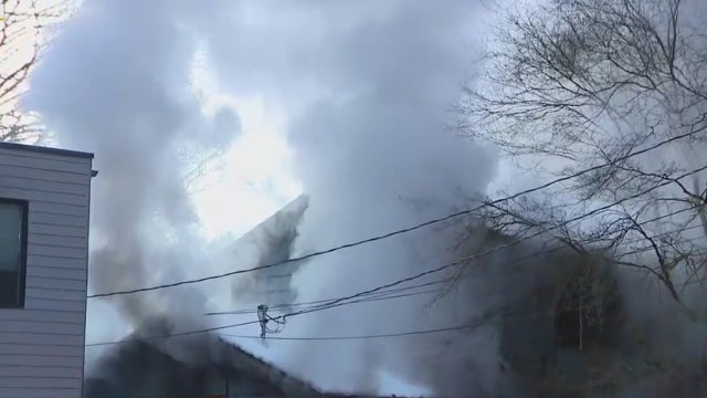 Crews respond to house fire in North Seattle, woman in critical condition