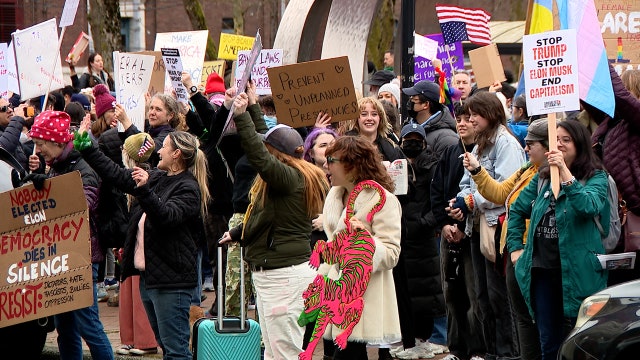 Crowds block traffic in Seattle during International Women's Day march
