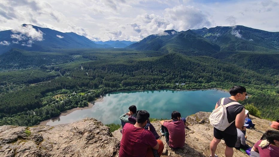 hikers sitting at top of rattlesnake ridge