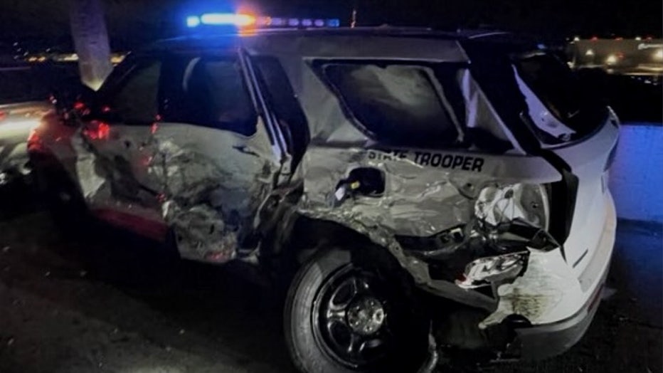 A driver was arrested early Monday after crashing into a Washington State Patrol (WSP) trooper's vehicle near Boeing Field. WSP Trooper Rick Johnson shared photos of the crash on social media at around 7:28 a.m. According to authorities, the trooper had pulled over another vehicle on the right shoulder of southbound I-5 near Boeing Field at around 2:40 a.m. when a third vehicle struck the patrol car, pushing it into the stopped vehicle. Despite significant damage to the patrol car shown in the photos, no injuries were reported. The driver who caused the crash was arrested on suspicion of impairment. This is a developing story. Check back for updates.