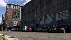 Seattle hotel blames abandoned building next door for crime, fires, guest complaints