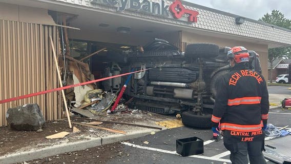 PHOTOS: Car crashes through front doors of Spanaway, WA bank