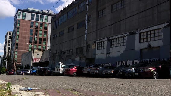 Seattle hotel blames abandoned building next door for crime, fires, guest complaints